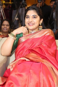actress Nivetha Thomas gorgeous in a red saree at a movie event