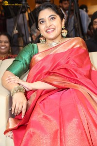 actress Nivetha Thomas gorgeous in a red saree at a movie event