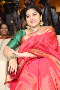 actress Nivetha Thomas gorgeous in a red saree at a movie event
