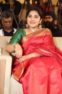 actress Nivetha Thomas gorgeous in a red saree at a movie event