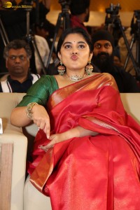 actress Nivetha Thomas gorgeous in a red saree at a movie event