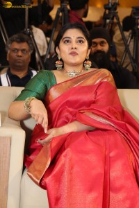 actress Nivetha Thomas gorgeous in a red saree at a movie event