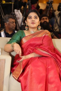 actress Nivetha Thomas gorgeous in a red saree at a movie event
