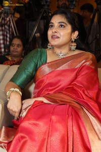 actress Nivetha Thomas gorgeous in a red saree at a movie event