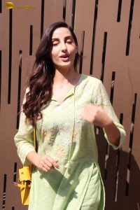 actress nora fatehi in a green salwar kameez
