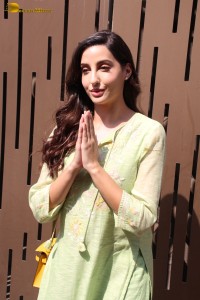 actress nora fatehi in a green salwar kameez