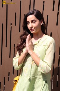 actress nora fatehi in a green salwar kameez