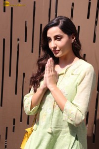 actress nora fatehi in a green salwar kameez