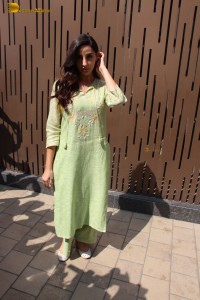 actress nora fatehi in a green salwar kameez