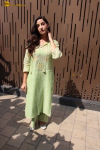 actress nora fatehi in a green salwar kameez