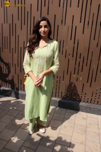 actress nora fatehi in a green salwar kameez