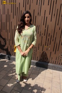 actress nora fatehi in a green salwar kameez