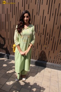 actress nora fatehi in a green salwar kameez