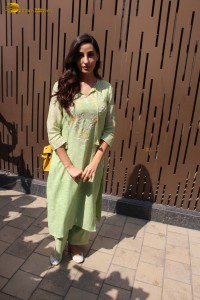 actress nora fatehi in a green salwar kameez