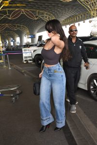 bollywood actress Nora Fatehi cute in a brown top and blue jeans at mumbai airport