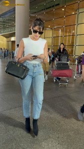 Actress Nora Fatehi in a white top and denim jeans at airport