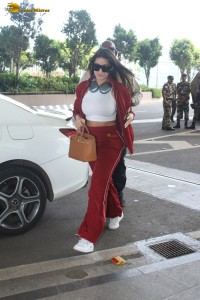 bollywood actress nora fatehi in stylish attire at airport