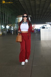 bollywood actress nora fatehi in stylish attire at airport