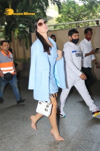 Bollywood Actress Nora Fatehi sizzles in a Blue Dress at Mumbai Airport