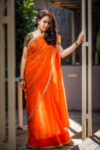 Telugu Actress Pallavi Dora Photoshoot in a orange saree