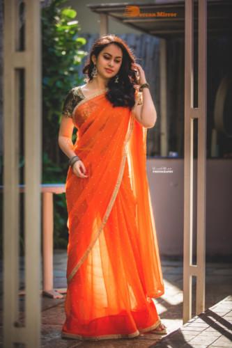Telugu Actress Pallavi Dora Photoshoot in a orange saree