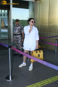 actress Parineeti Chopra in a short white dress at mumbai airport