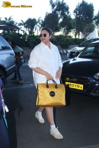 actress Parineeti Chopra in a short white dress at mumbai airport
