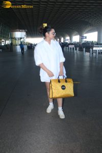 actress Parineeti Chopra in a short white dress at mumbai airport
