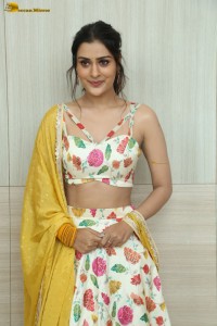 actress Payal Rajput in a white and yellow lehenga choli