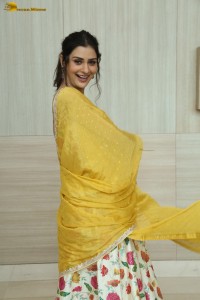 actress Payal Rajput in a white and yellow lehenga choli