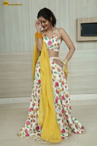 actress Payal Rajput in a white and yellow lehenga choli