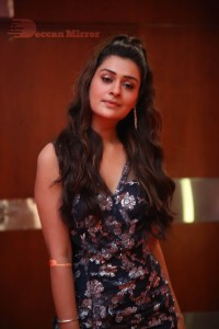 Actress Payal Rajput in a blue dress