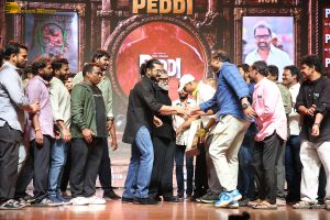 Peddi Mega Blockbuster Event attended by Ram Charan, Chiranjeevi, and others