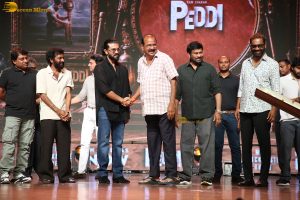 Peddi Mega Blockbuster Event attended by Ram Charan, Chiranjeevi, and others