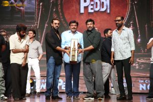 Peddi Mega Blockbuster Event attended by Ram Charan, Chiranjeevi, and others