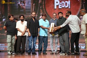 Peddi Mega Blockbuster Event attended by Ram Charan, Chiranjeevi, and others