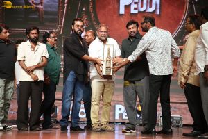 Peddi Mega Blockbuster Event attended by Ram Charan, Chiranjeevi, and others