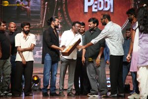 Peddi Mega Blockbuster Event attended by Ram Charan, Chiranjeevi, and others