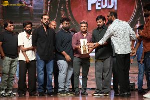 Peddi Mega Blockbuster Event attended by Ram Charan, Chiranjeevi, and others