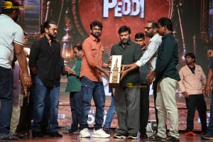 Peddi Mega Blockbuster Event attended by Ram Charan, Chiranjeevi, and others