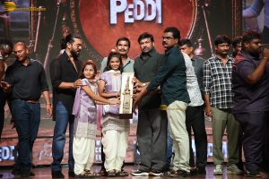 Peddi Mega Blockbuster Event attended by Ram Charan, Chiranjeevi, and others