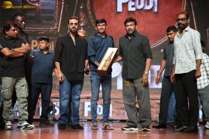 Peddi Mega Blockbuster Event attended by Ram Charan, Chiranjeevi, and others