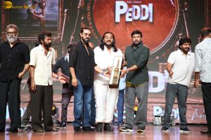 Peddi Mega Blockbuster Event attended by Ram Charan, Chiranjeevi, and others