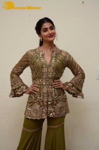 Pooja Hegde in a dark green dress