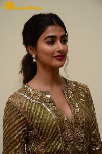 Pooja Hegde in a dark green dress