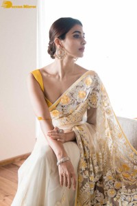 Pooja Hegde in a light yellow saree