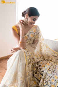 Pooja Hegde in a light yellow saree