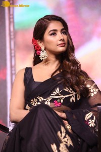 Pooja Hegde in a black saree while attending Acharya movie press meet