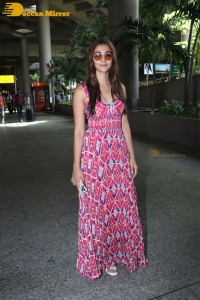 Actress Pooja Hegde in a pink summer dress spotted at Mumbai Airport
