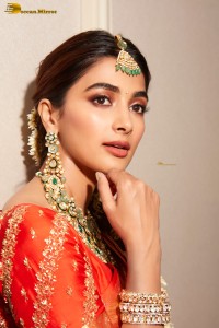 actress pooja hegde photoshoot in a red saree and jewelry